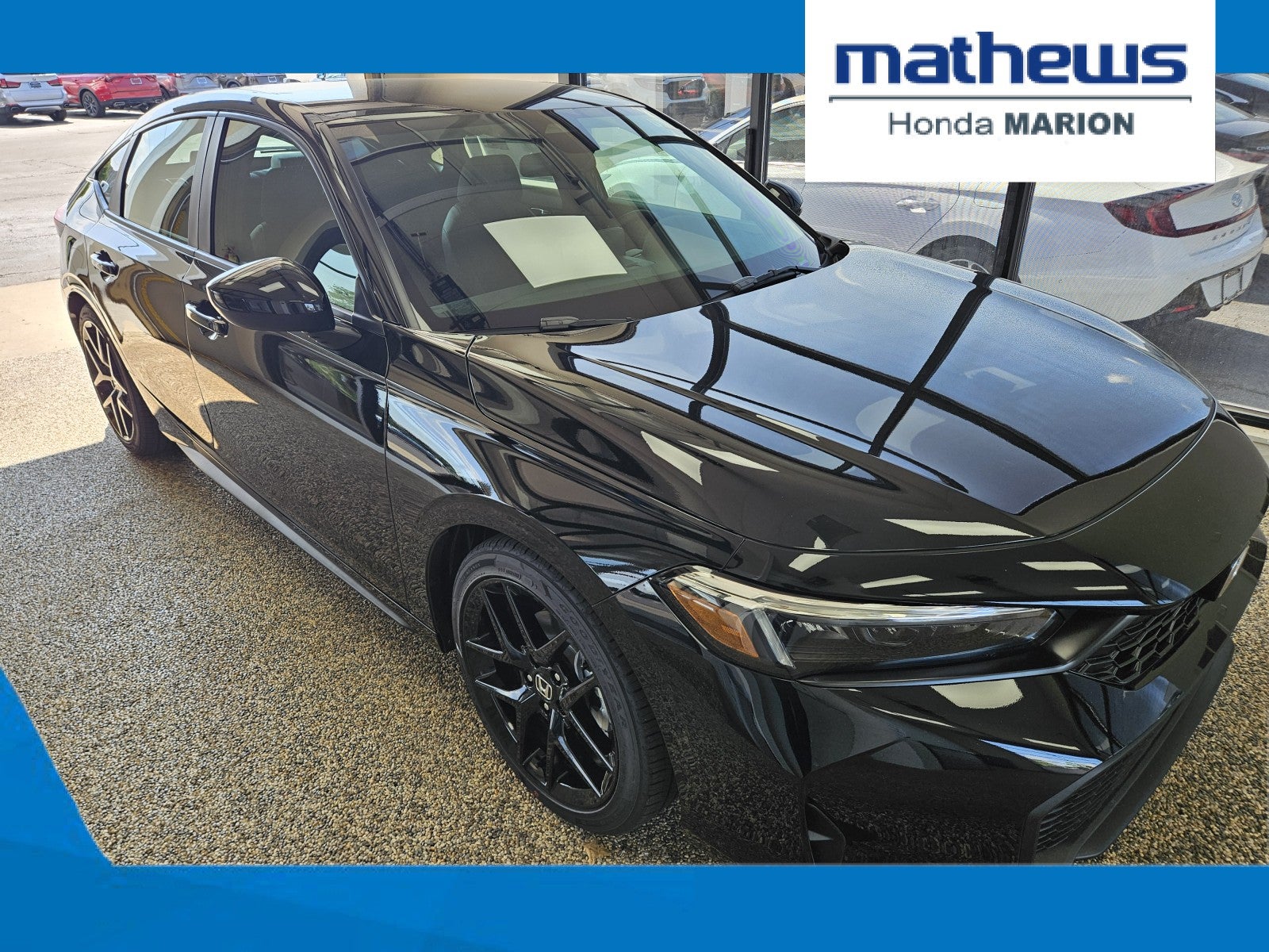 2026 Honda Civic Hatchback FWD Sport in Crystal Black Pearl — front three-quarter view