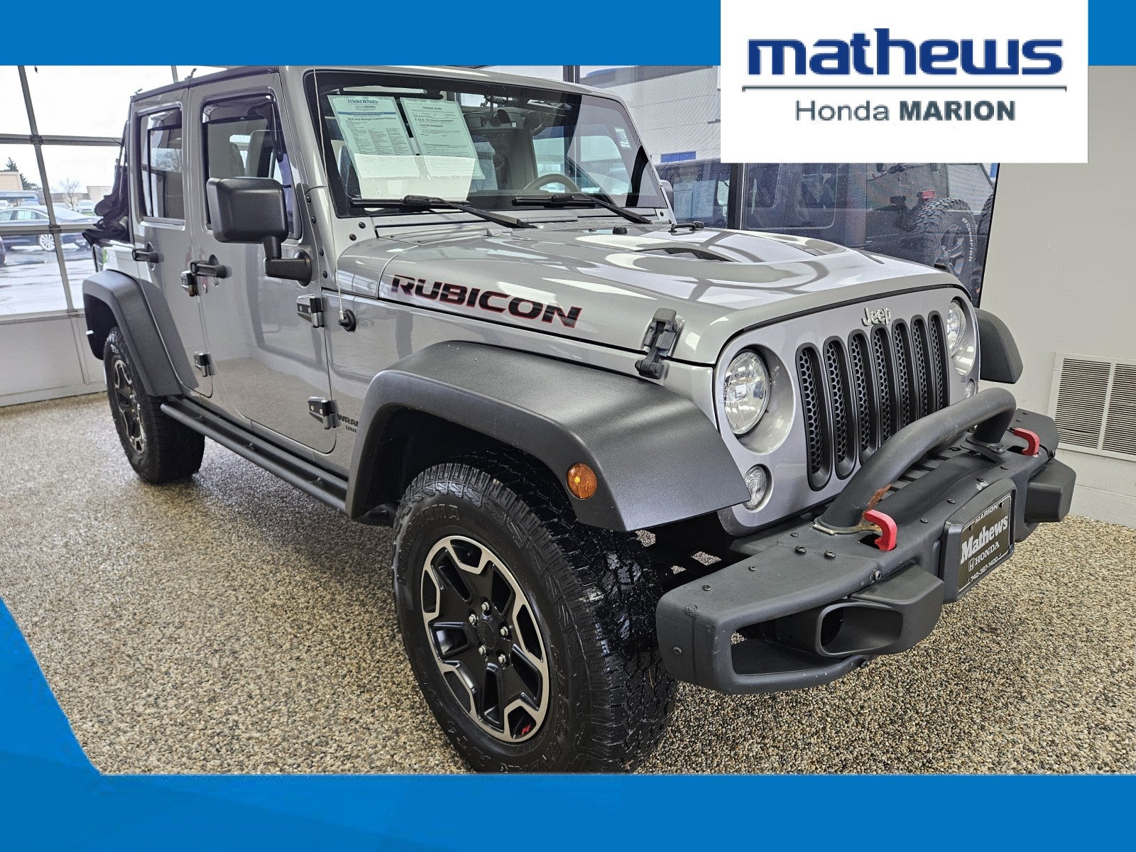 2016 Jeep Wrangler Unlimited Rubicon in Billet Silver Metallic Clearcoat — front three-quarter view