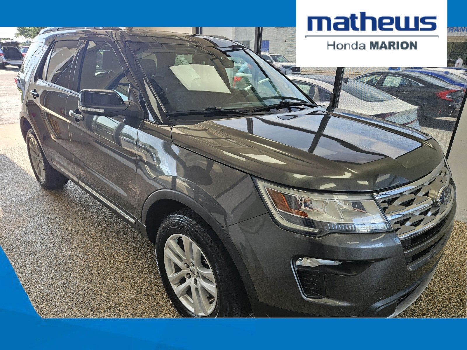 2018 Ford Explorer XLT in Magnetic Metallic — front three-quarter view