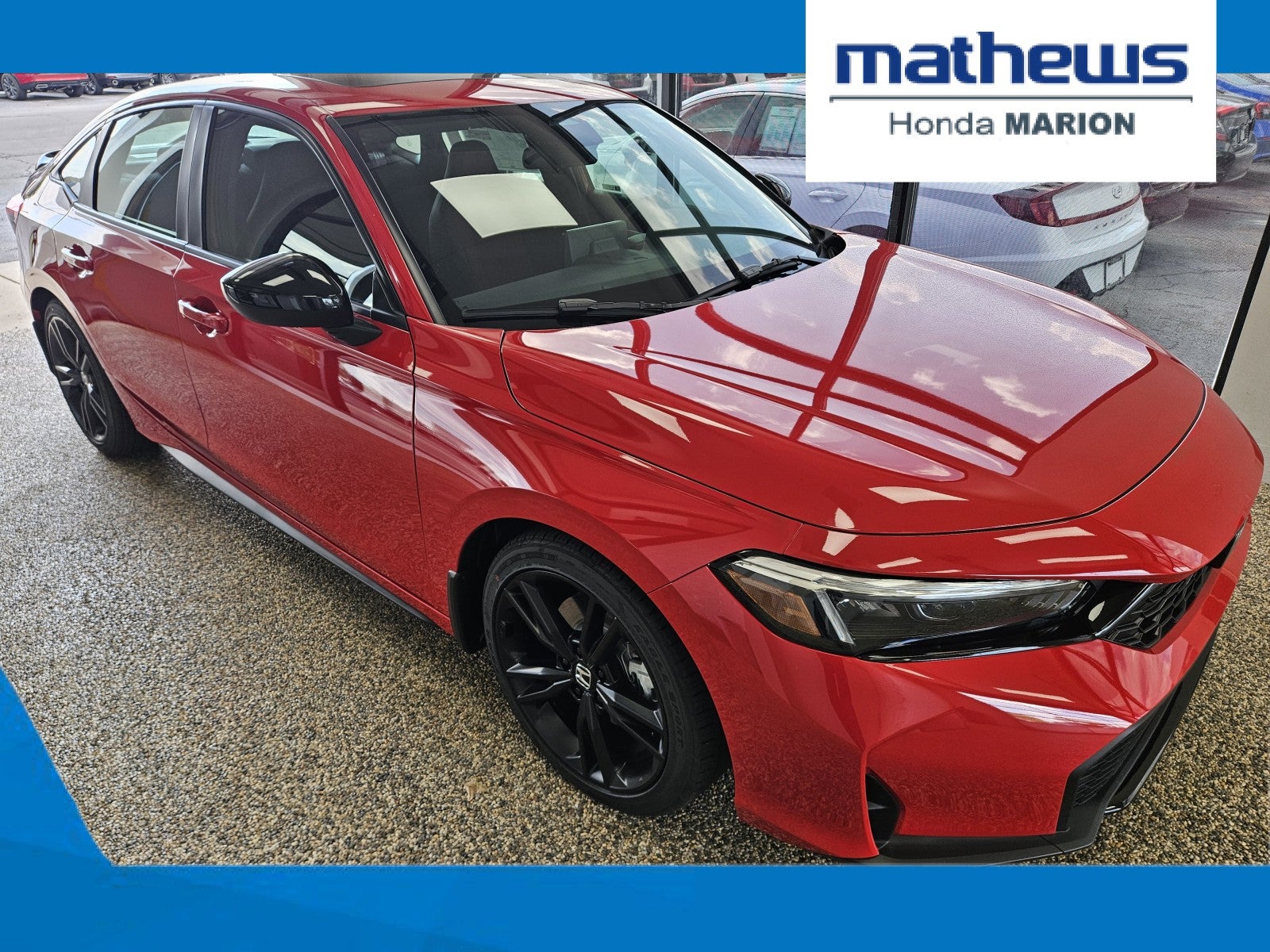 2026 Honda Civic Si Sedan FWD in Rallye Red — front three-quarter view