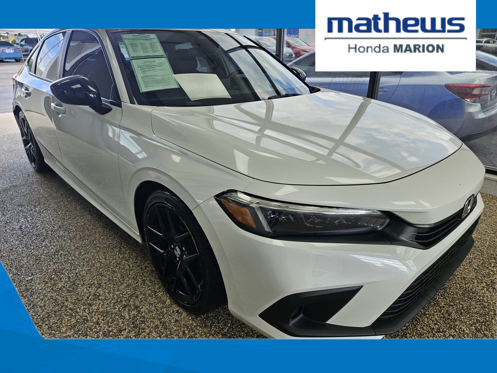 2022 Honda Civic Sedan Sport in Platinum White Pearl — front three-quarter view