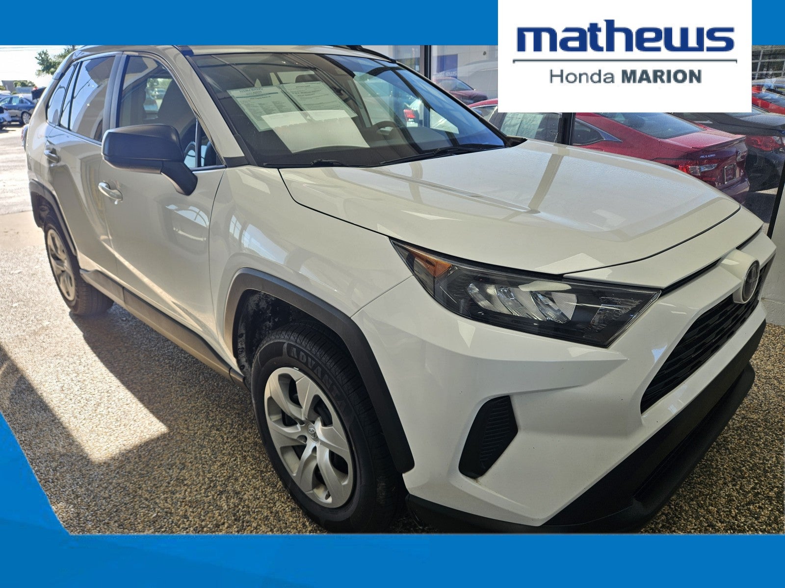 2020 Toyota RAV4 LE in Super White — front three-quarter view