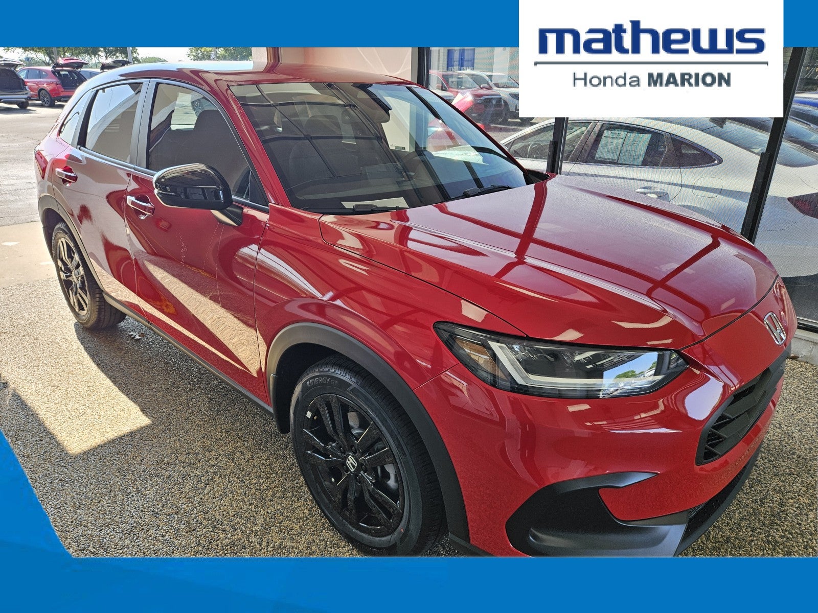 2027 Honda HR-V Sport AWD in Milano Red — front three-quarter view