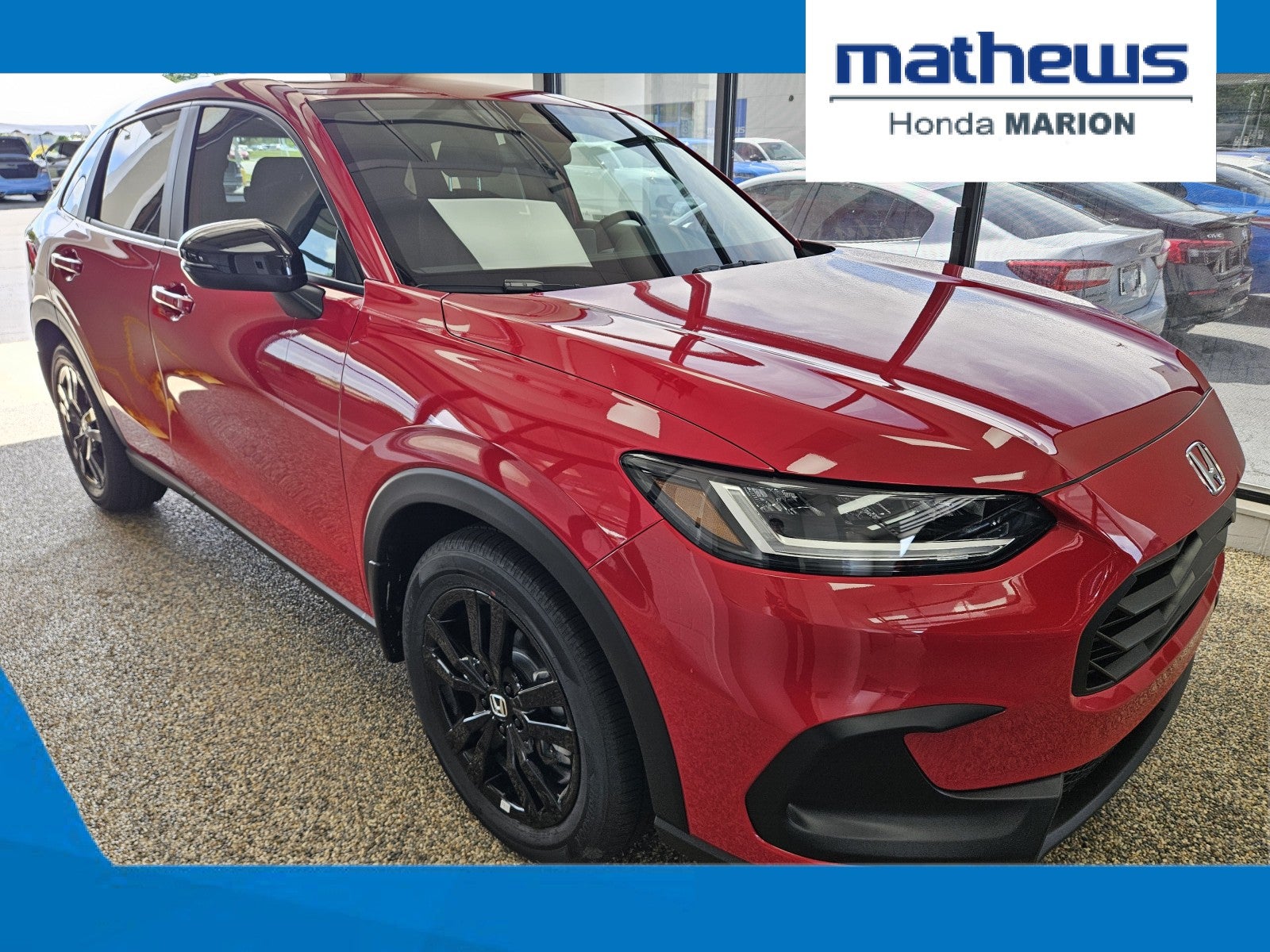 2027 Honda HR-V Sport AWD in Milano Red — front three-quarter view