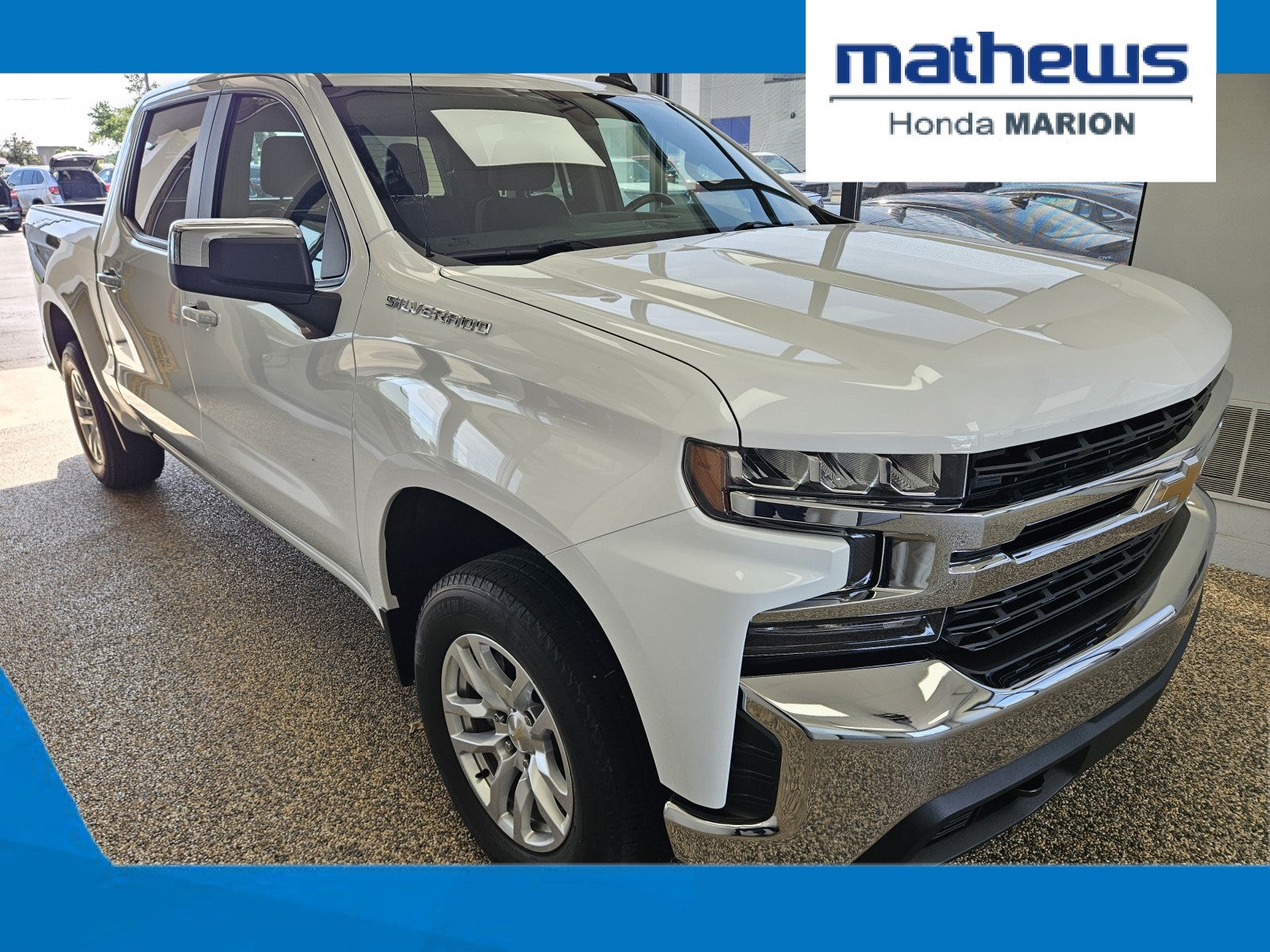 2021 Chevrolet Silverado 1500 LT in Summit White — front three-quarter view