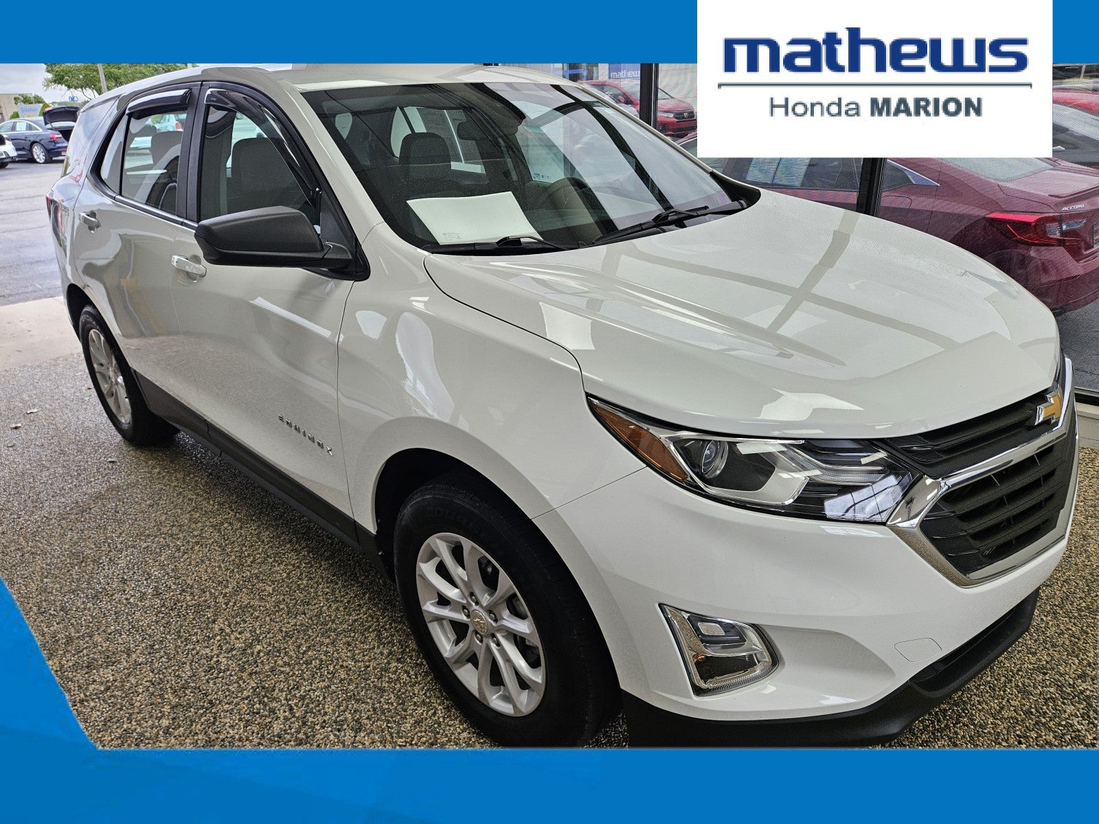 2021 Chevrolet Equinox LS in Summit White — front three-quarter view