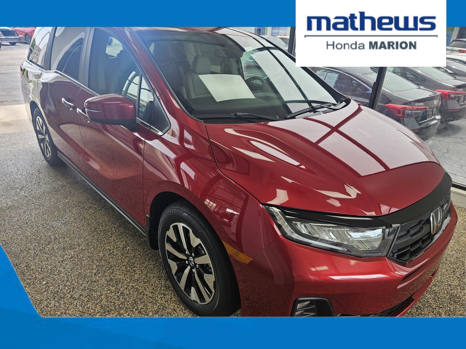 2026 Honda Odyssey EX-L in Radiant Red Metallic II — front three-quarter view