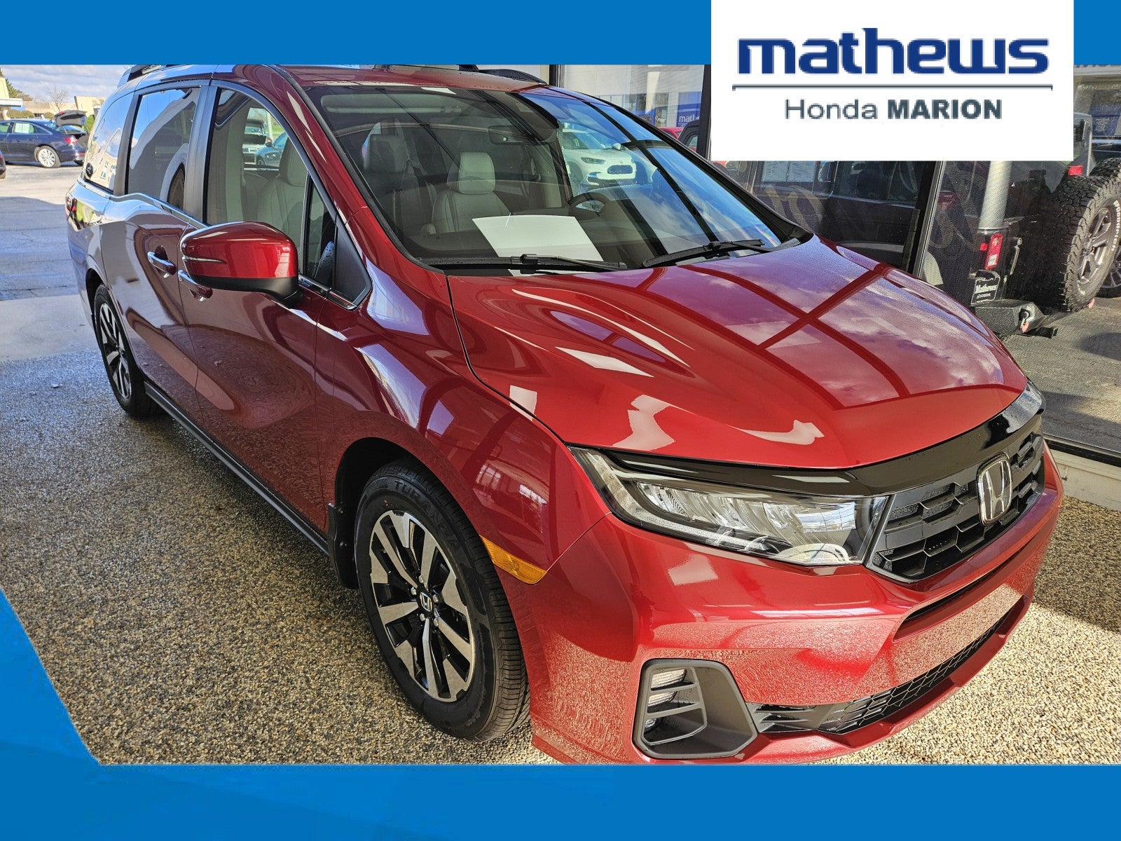 2026 Honda Odyssey EX-L in Radiant Red Metallic II — front three-quarter view