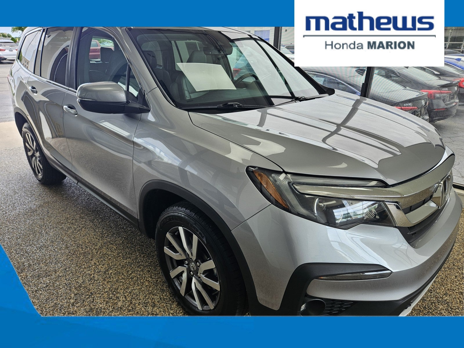 2022 Honda Pilot EX-L in Lunar Silver Metallic — front three-quarter view
