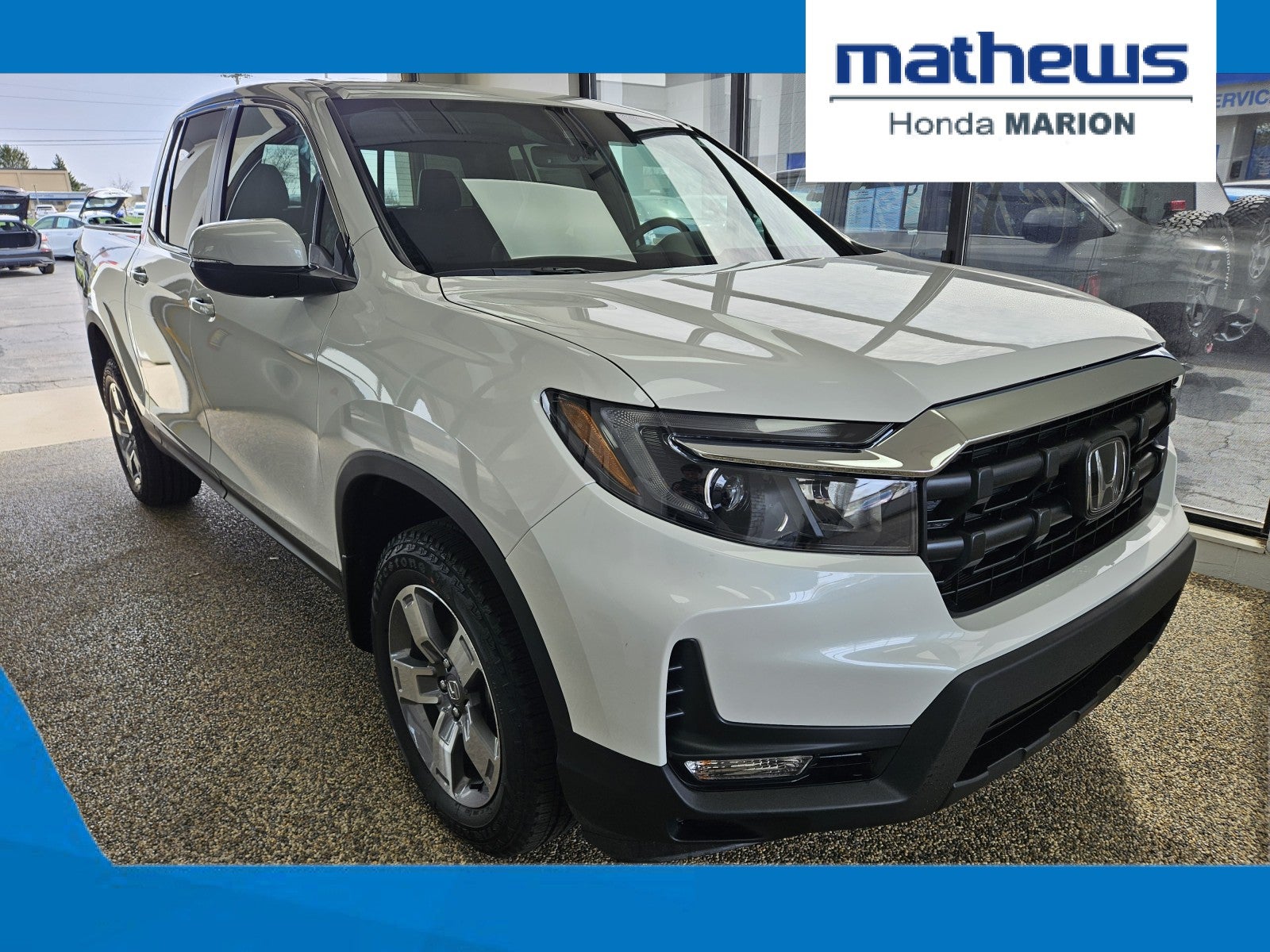 2026 Honda Ridgeline RTL in Platinum White Pearl — front three-quarter view