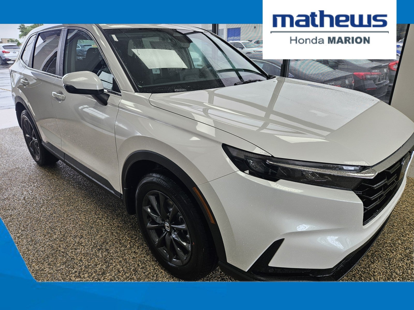 2026 Honda CR-V AWD EX-L in Platinum White Pearl — front three-quarter view