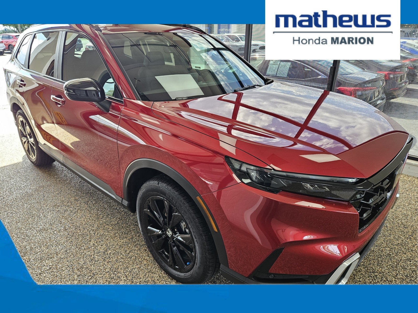 2026 Honda CR-V AWD Sport Touring Hybrid in Radiant Red Metallic — front three-quarter view